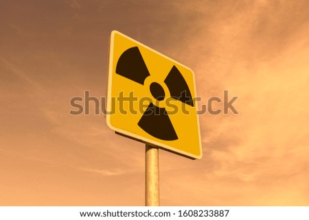 Radioactivity and chemical hazard street sign with toxic clouds on the background: pollution and danger concept