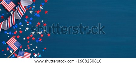 Happy Presidents Day banner with grosgrain ribbon, American flags and confetti stars on blue background. USA Independence Day, American Labor day, Memorial Day, US election concept. Royalty-Free Stock Photo #1608250810