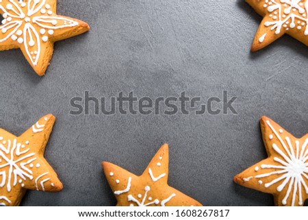 Christmas homemade gingerbread cookies on dark background.