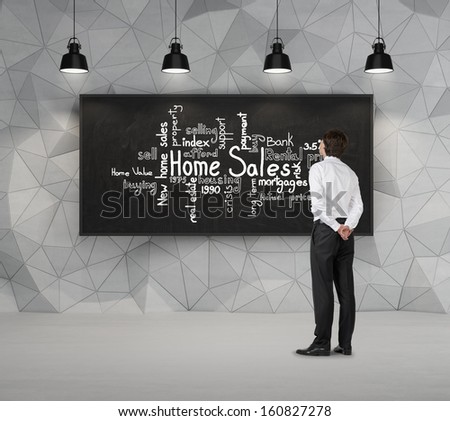 Businessman looking at home sales