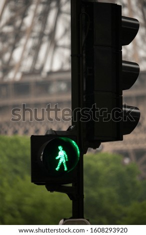 Green traffic light on a street in Paris