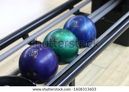 bowling balls on the station of returning machine  