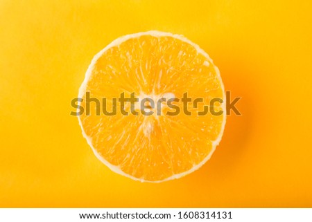 Orange slice isolated on yellow background