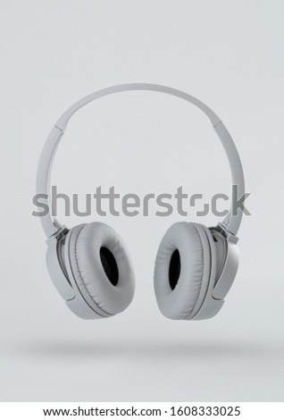 Gray headphones on gray background