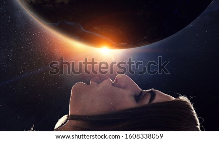 Woman kiss globe . Mixed media