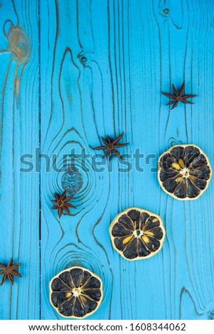 Happy new year and Merry Christmas cozy concept. Decoration lemon and cynammon on wooden background
