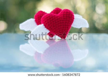 Beautiful red heart on a natural bokeh background. Valentine's Day .
