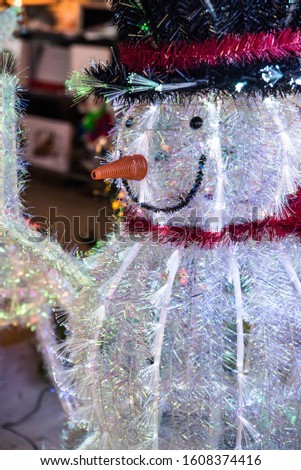 Happy new year and Merry Christmas card concept. Beautiful Christmas tree with new year decoration, lights, balls and toys on blurred and defocused, sparkling background