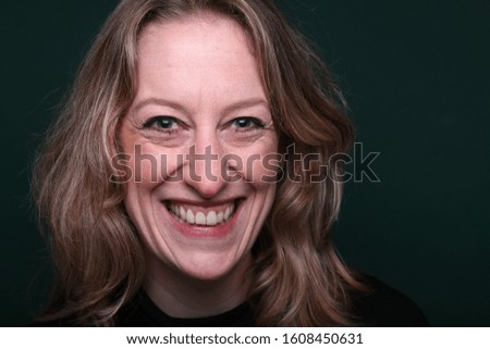Commercial caucasian woman in front of a background