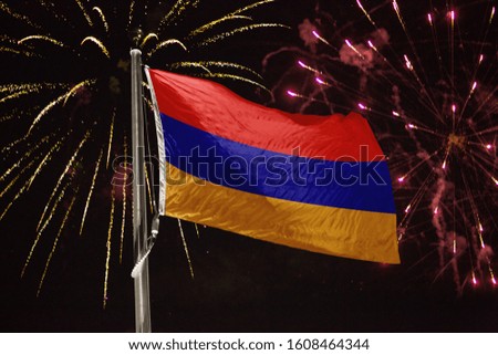 Armenia flag blowing in the wind at night