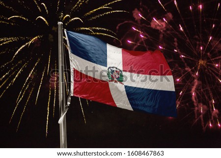 Dominican Republic flag blowing in the wind at night