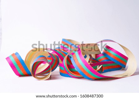A paper streamer laying on white background - close up