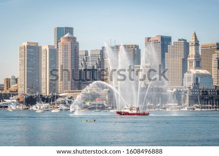 A Boston fire boat shoots water into the air on the 4th of July