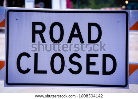 Road closed sign up close