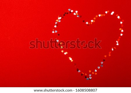 Heart on a red background from small hearts.
