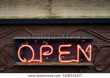 Neon open sign on wood and pattern