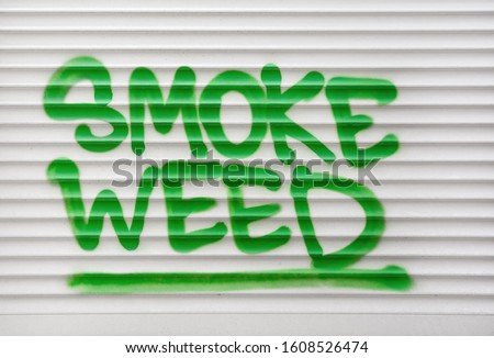 Smoke weed green text sign
