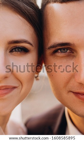 Beautiful newlyweds are smiling. Wedding idea. Wedding faces. Wedding photography. Half face.