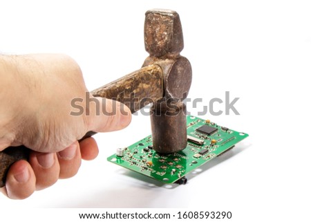 hammer blow on an electronic board. White background