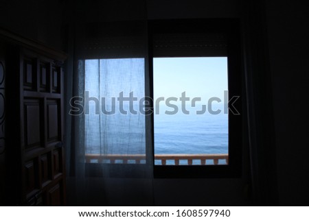 The sea seen through a window