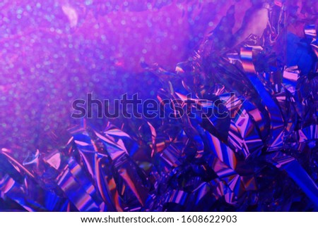 Abstract multicolored violet blue rainbow psychedelic light streaks background.