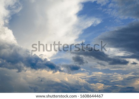 White Clouds Illuminated by the Sun in the Sky Background