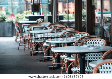 Tables and chairs outside a restaurant Royalty-Free Stock Photo #1608657625
