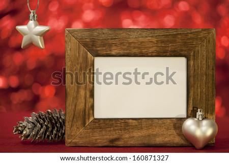 star and heart and pine cone on red background christmas card