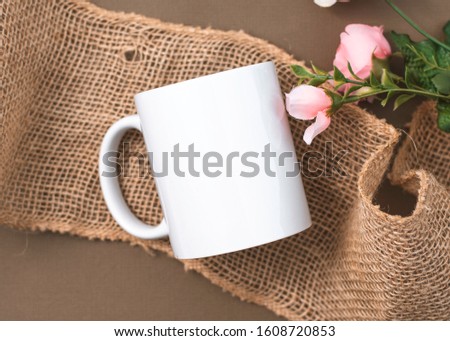 Rustic Styled Blank Mug Mockup with Burlap and Roses Royalty-Free Stock Photo #1608720853