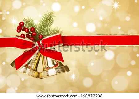 Jingle bells with red ribbon bow on festive background