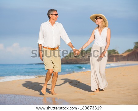 Happy senior couple on the beach. Retirement Luxury Tropical Resort