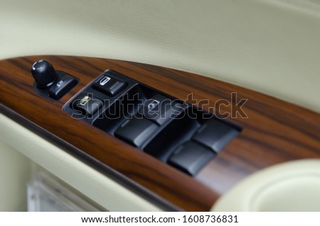Interior car door panel. Window push button switch