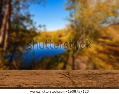 Empty wooden table with nature background