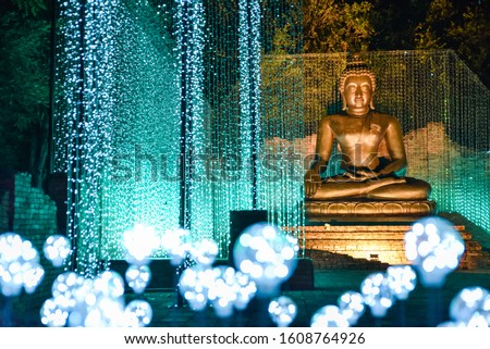 (Public place) Buddha statue and light up.Buddhists believe that there are many Buddhas. The most recent one was Gautama Buddha. People who will become Buddhas someday are called "bodhisattvas." 