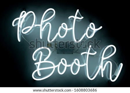 Neon sign that says "Photo Booth"