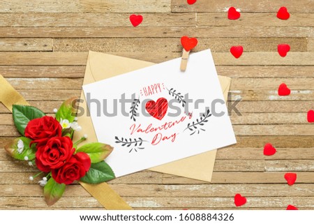 Mockup letter and envelop on wood with with happy valtentine's day text and red roses and red hearts. Mock up for elegant design. Flat lay top view valentine's day vintage retro background concept.