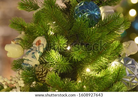 Photography of decoration of Christmas tree. Bright balls in focus. Concepts of holidays, New Year's Eve, good mood and vacations