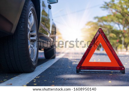 Red triangle, red emergency stop sign, red emergency symbol with  car stop and park on road.