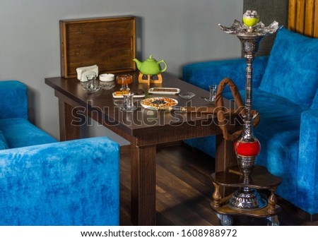 Hookah (shisha) and tea set on a table ,Traditional Azerbaijan tea set: jam, hookah, baklava, chocolate, limon