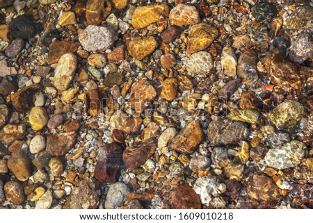 Background picture of the shading formed by the stones on the seashore