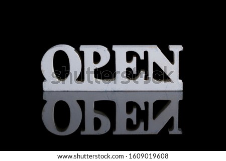 Open wooden sign board. Crafted board. Vintage style suit for cafe. Black background. Board to attract customer.