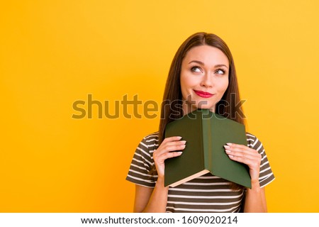 Close up photo of dreamy positive girl red lips-stick rest relax read poetry book think thoughts imagine story look copy space wear stylish clothing isolated yellow color background