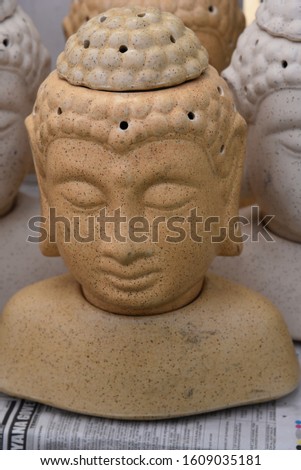 Lord Buddha Statue Head Showpiece placed in a market shop for sale 