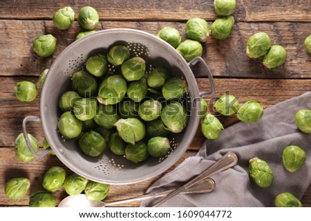 raw brussel sprouts on wood background