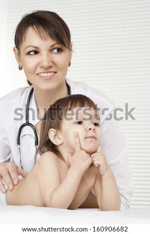 pediatrician with little cute girl