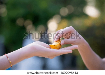 close up holding Golden Medal of the Chinese people,New Year festival, celebration, Festivities concept, selected focus