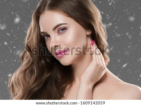 Beautiful hair winter woman portrait healthy skin and hair snowflakes
snow background