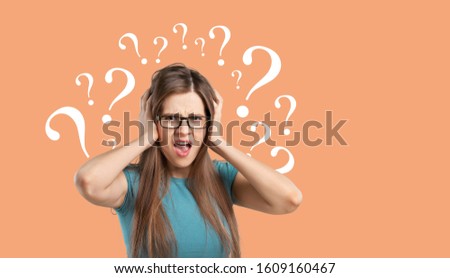 Question sign with a beautiful alarmed woman on pastel background