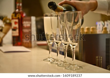 glasses of prosecco as they are poured