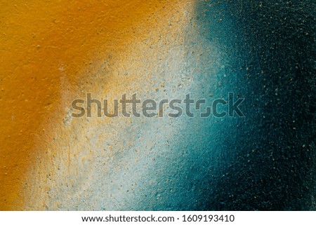 Beautiful bright colorful street art graffiti background. Abstract geometric spray drawing fashion colors on the walls of the city. Urban Culture detailed close up texture red, yellow ,blue picture